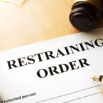 someone signing a restraining order