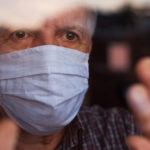 a man in a nursing home with a facemask