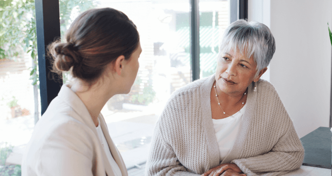 Senior talking with a women