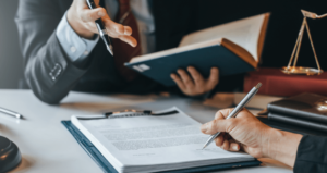 Lawyers reviewing power of attorney documents at a table.
