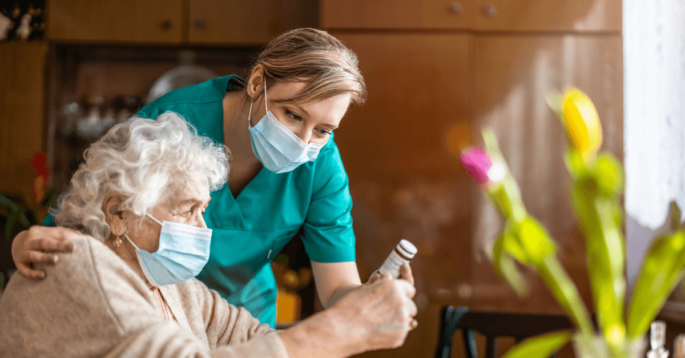 Nurse helping elderly women