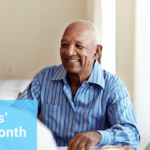 Elderly people sit and laugh together