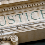 Court house with justice written on the front