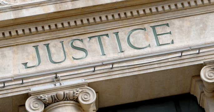Court house with justice written on the front