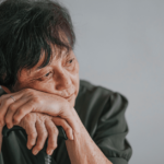 Woman rests on cane